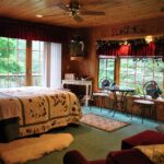 Horton Creek Bed and Breakfast Guest Room with Cabin Decor and many windows